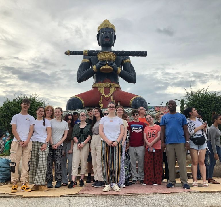 QMC students visiting The Black Man monument in Cambodia