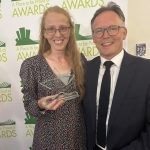 Stella Gibbons pictured with her trophy, alongside Mark Henderson, Principal of QMC