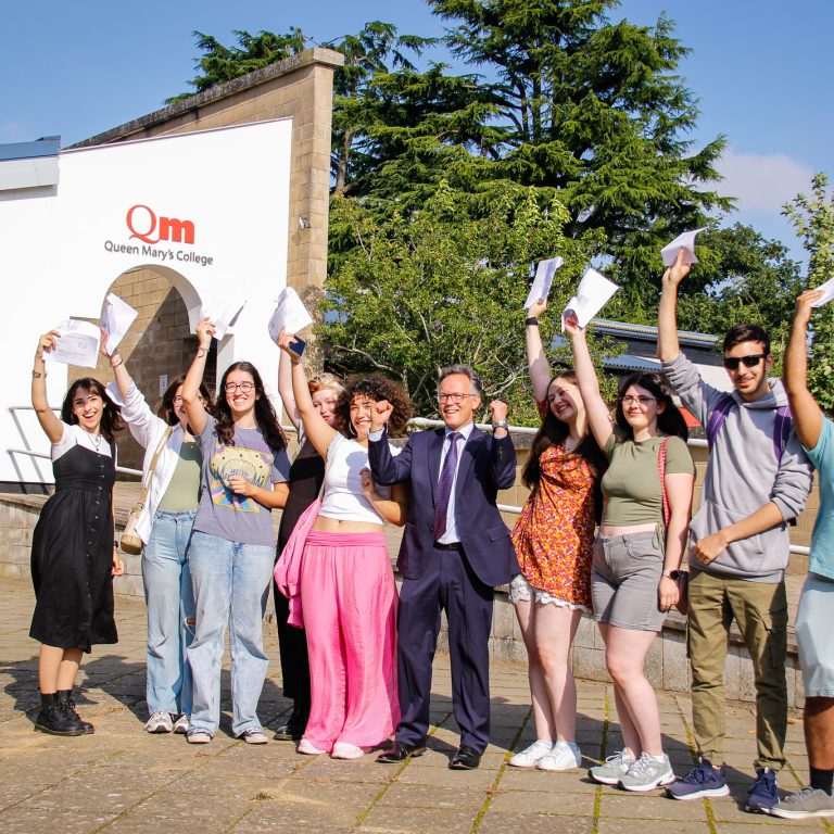 Queen Mary's College, Basingstoke are pictured celebrating outstanding A Level/ Level 3 Results, alongside Principal Mark Henderson.