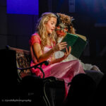 AJ Fitzgibbon as Belle and Thomas Davies as Beast performing on stage at QMC's Production of Beauty and the Beast