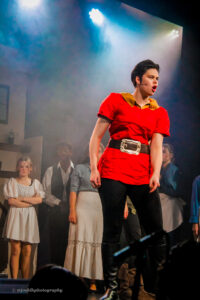 Performing Arts student MJ Nikolic as Gaston pictured performing on stage