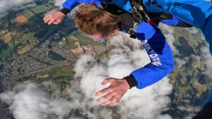 Boy skydiving in the air.