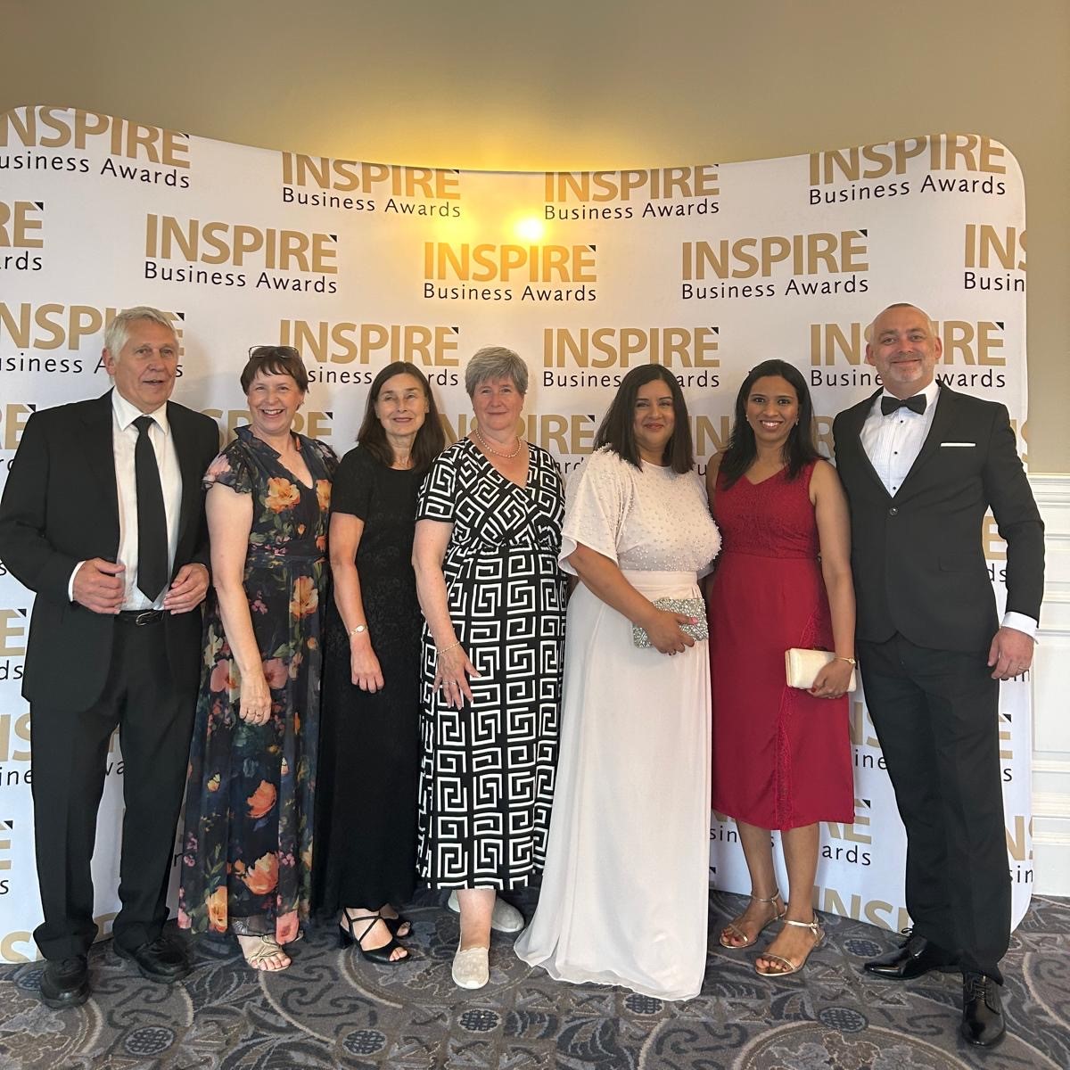 a group of people posing for a photo at an event