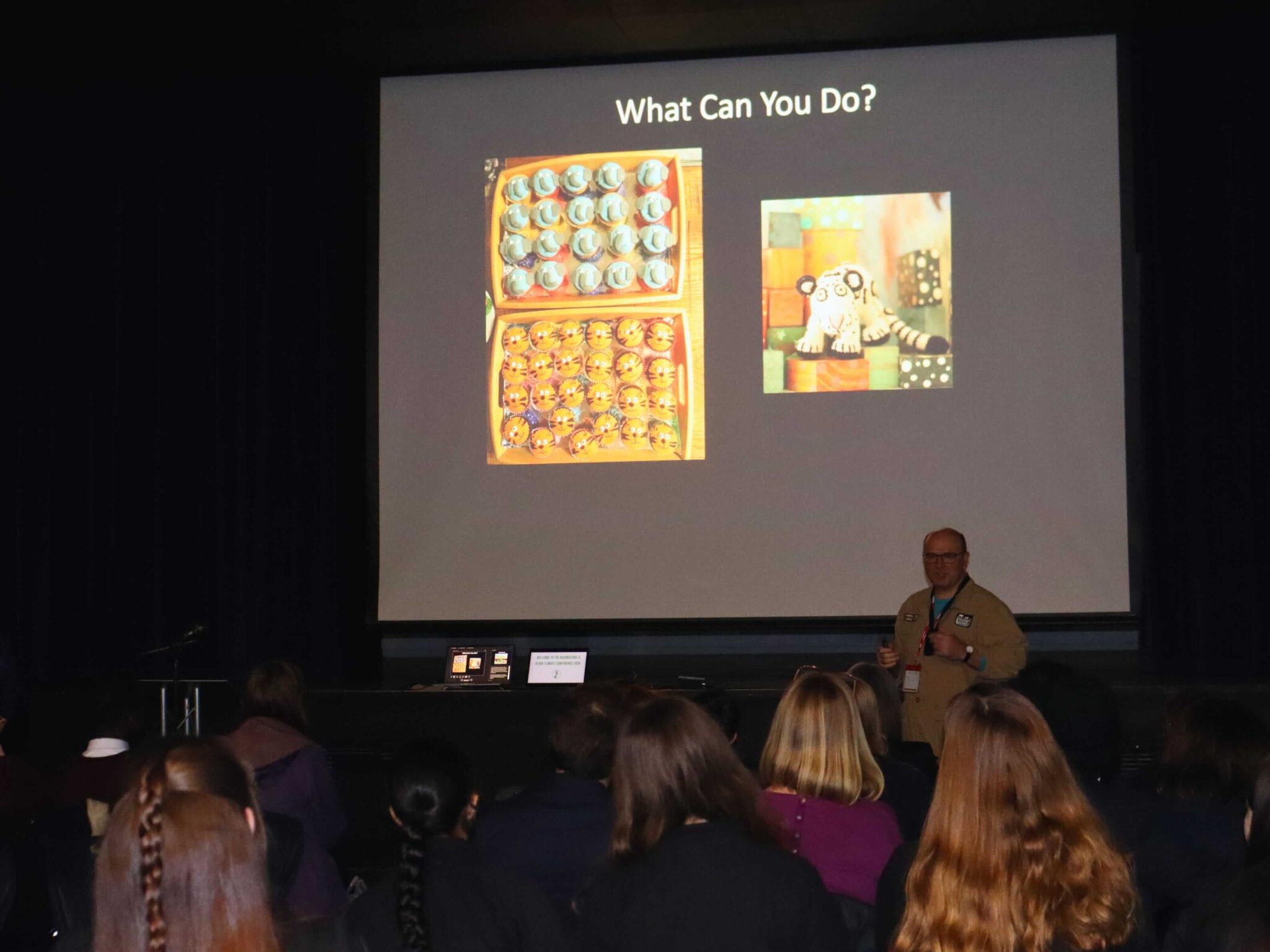 someone standing in front of a screen