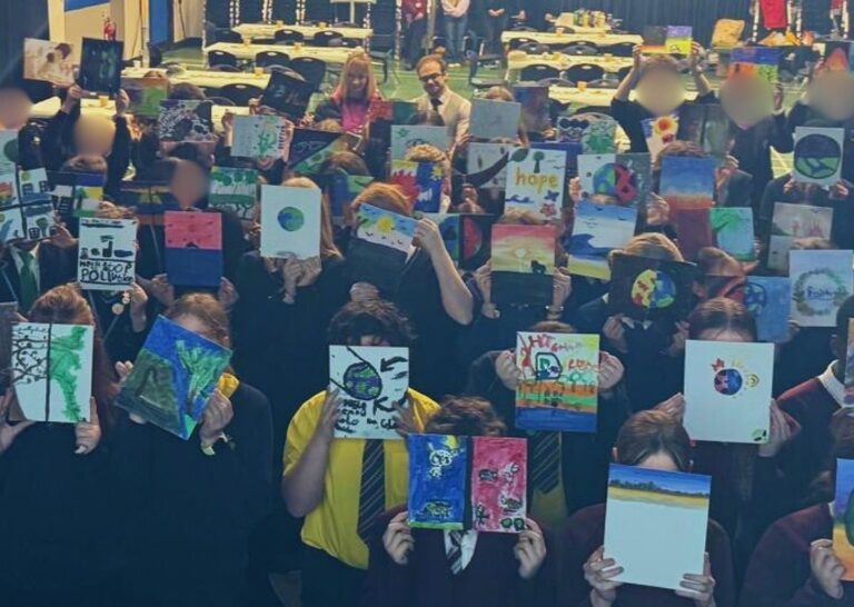 group of people holding up a certificate