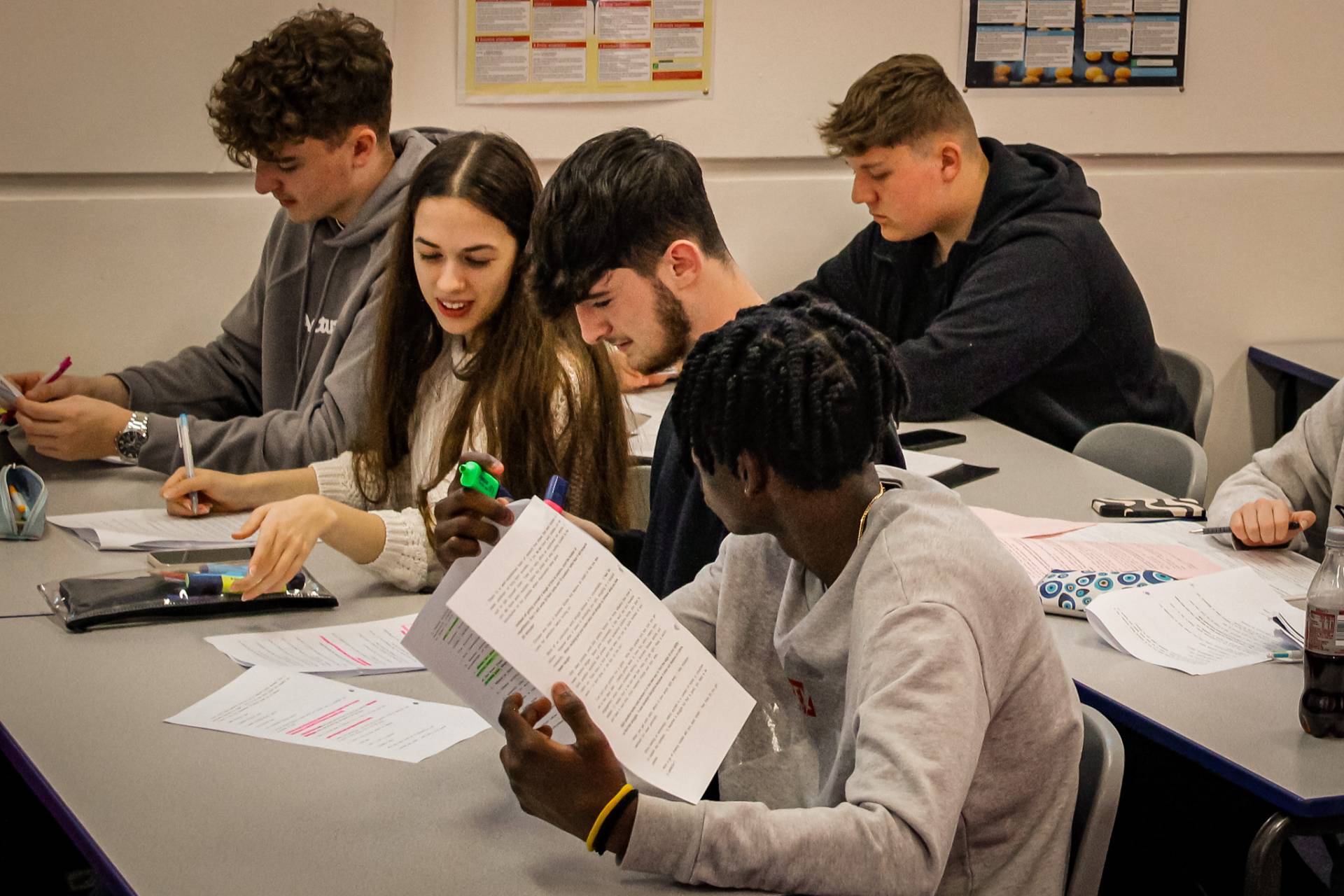 A group of students pictured in a classroom at Queen Mary's College.