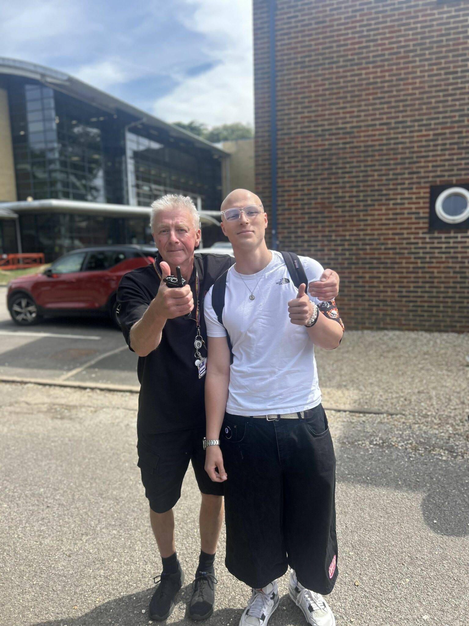 Two guys with their thumbs up