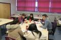 QMC Politics teacher discussing with students in class